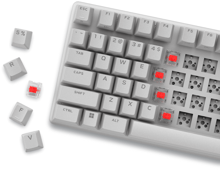 A white keyboard with red buttonsDescription automatically generated